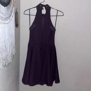 Purple mini dress. Sleeveless with open back and two buttons on the back.
